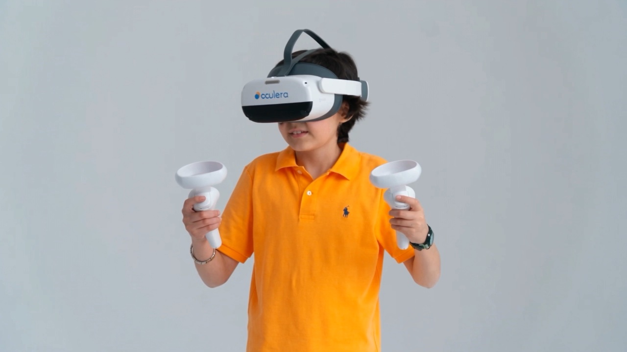 A child wearing the VR headset, holding the controller