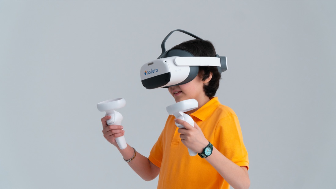 A student mid-game with both controllers during a screening session
